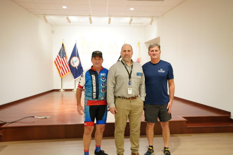 Gen. Goldfein (ret.) poses with Robert Beletic and Virginia War Memorial staff.